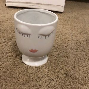 A white make up brush holder